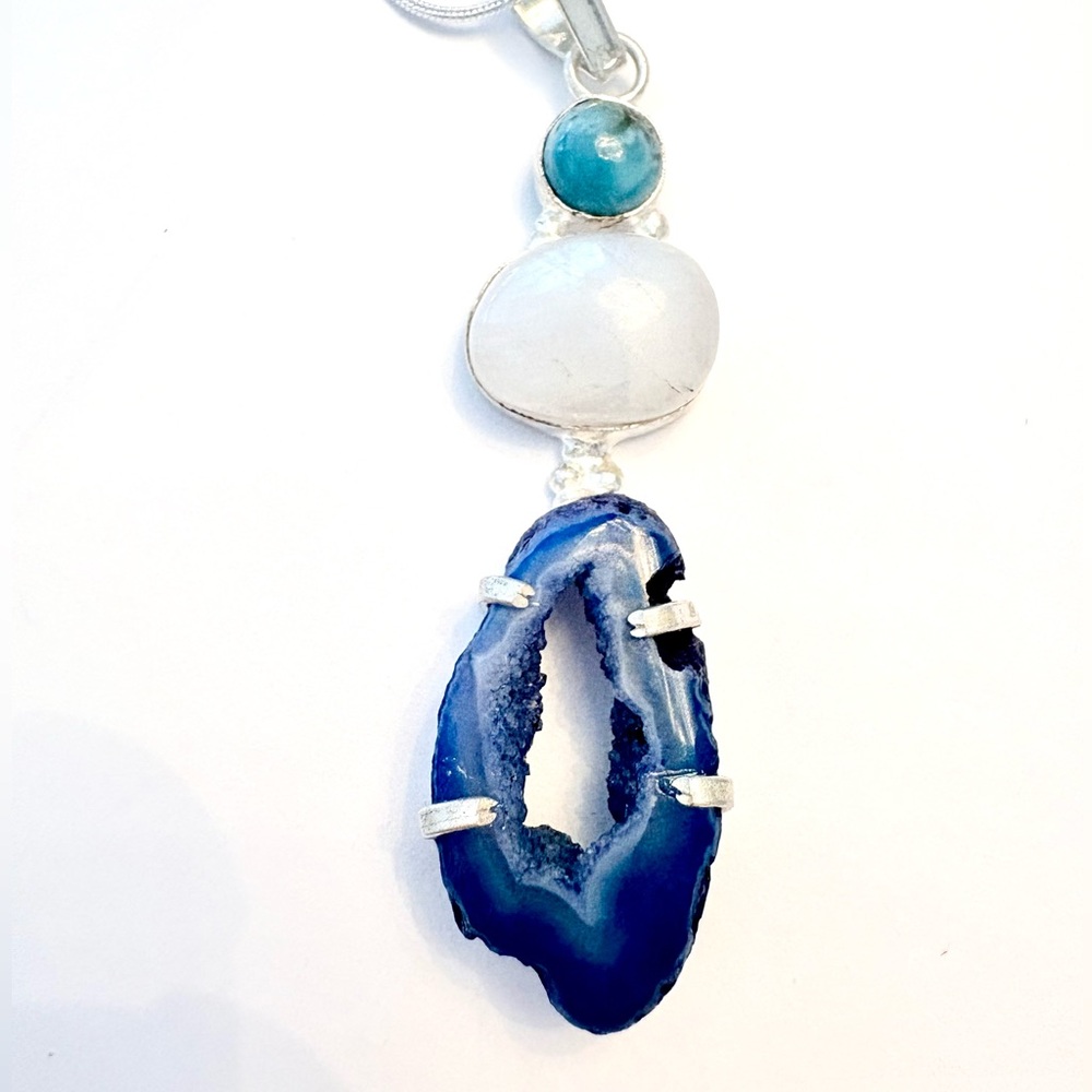 2 1/2 inch, Agate Geode slice and Rainbow Moonstone pendant on a silver chain.